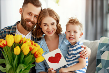 Wall Mural - happy mother's day! father and child congratulate mother on holiday .