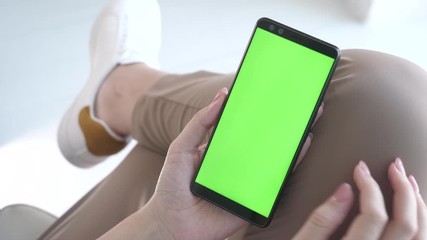 Mock-up for watching online app store closeup. Modern lifestyle of busy woman using smartphone for tracking message or reading advertising pov. Swiping right on electronic green screen for web surfing