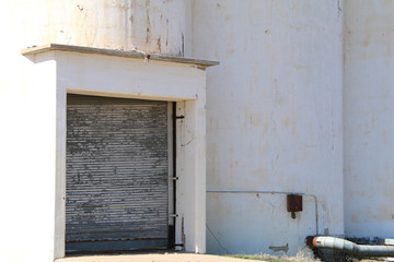 Wall Mural - white grain silo building loading receiving door