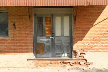 Wall Mural - vintage double warehouse shipping receiving doors afternoon shadows