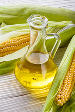 Corn Oil On White Wooden Rustic Background