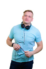 Portrait of a cheerful young guy with headphones. isolated on white background