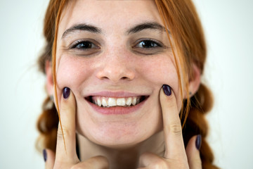 Wall Mural - Close up portrait of redhead pretty teenage girl.