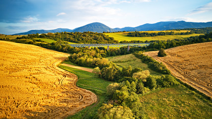 Wall Mural - Summer landscape with fields, meadows and railroad bridge in mountains