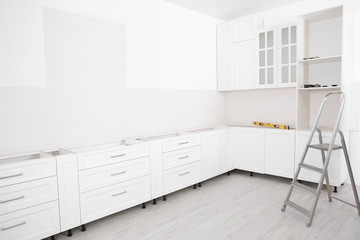 Canvas Print - Stylish kitchen interior with newly installed furniture