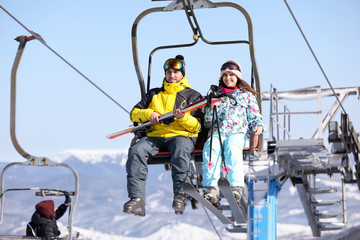 Sticker - People using chairlift at mountain ski resort. Winter vacation