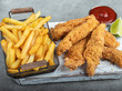 crispy fried breaded chicken breast strips french fries and sauce