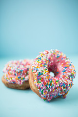 Poster - Pink donuts on blue background