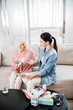 © Yakobchuk Olena - Doctor telling old woman about effective medicaments