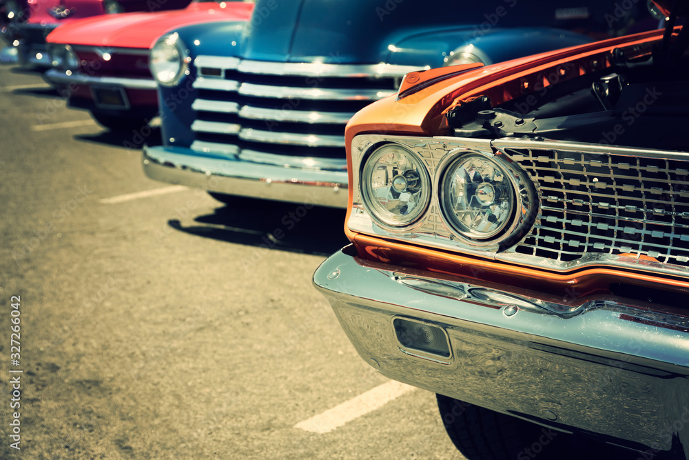 Classic cars parked in a row on the street - obrazy, fototapety, plakaty 