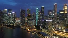 Singapore Content : Aerial Drone Travelling Shot Of Singapore City Skyline During Magic Hour At Marina Bay,  Singapore.