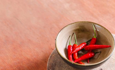 Minimalist still life photo of a bowl of red chillies to show concept of gastronomy, ayurveda and alternative medicine