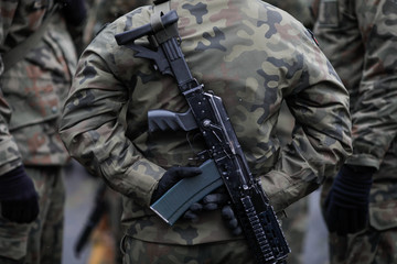 Wall Mural - Polish soldier armed with Beryl assault rifle at the Romanian National Day military parade