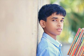 Wall Mural - Portrait of Indian little school boy posing to camera