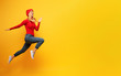 © alphaspirit - Girl runs fast. concept of energy and vitality.yellow background