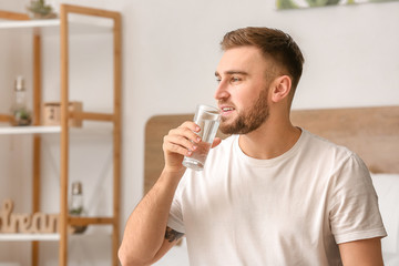 Poster - Morning of young man drinking water in bedroom