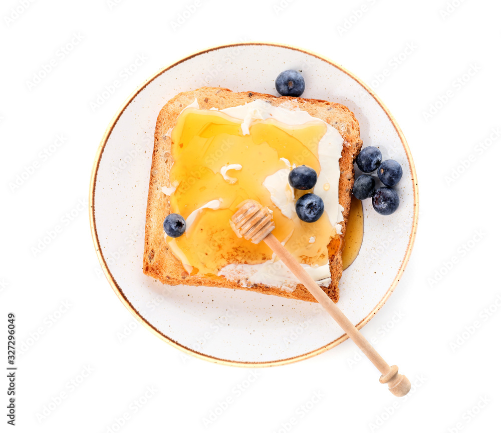 Tasty toasted bread with honey, butter and berries on white background