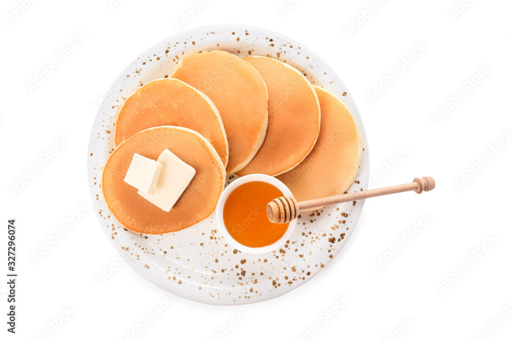 Tasty pancakes with honey and butter on white background