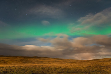  Aurora Borealis in Iceland northern lights shining green in night sky beyond the asterisk Big Dipper