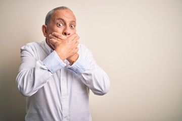 Sticker - Senior handsome businessman wearing elegant shirt standing over isolated pink background shocked covering mouth with hands for mistake. Secret concept.