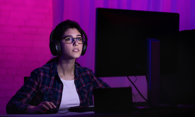 Girl At Desktop Computer Playing Online Shooter Games At Night