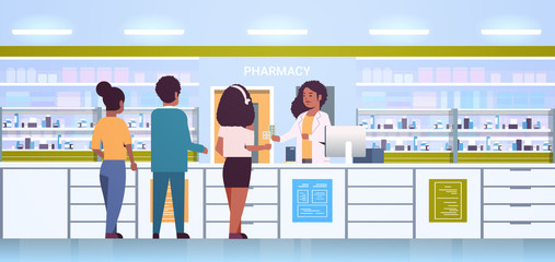 Wall Mural - female doctor pharmacist giving pills to customers african american patients at pharmacy counter modern drugstore interior medicine healthcare concept horizontal full length vector illustration