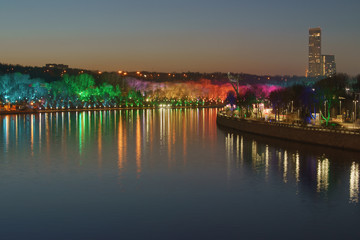 Wall Mural - Photography of illuminated colorful public park Sparrow Hills / Vorobyovy Gory / Lenin Hills in winter night Moscow. Concepts of beauty of bright big city.