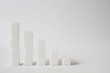 high key of five collumns made of sugar cubes with decreasing height symbolizing the need of reducing sugar consumption
