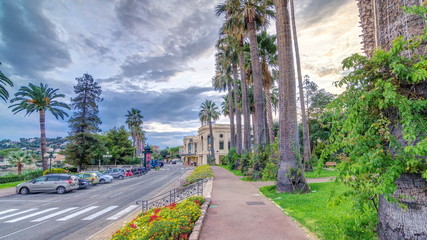 Evening view to palms on the center street of Beaulieu-sur-Mer timelapse .