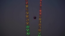 Reverse Bungee In The City Amusement Park At Evening.