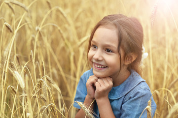 Sticker - Portrait of cute little girl in wheat field