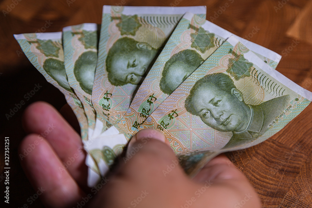 Paper Money Rmb Male hand with a fan of 1 Renminbi or Chinese yuan or abbreviated RMB ...