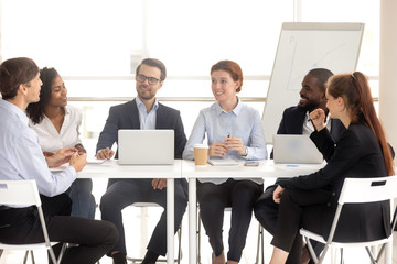 Wall Mural - Smiling man and woman employee at meeting negotiation.