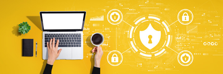 Wall Mural - Cyber security theme with person using a laptop computer