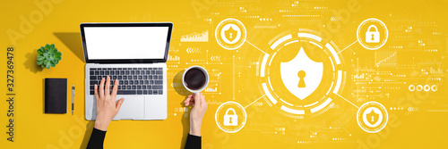 Cuadros en Lienzo Cyber security theme with person using a laptop computer