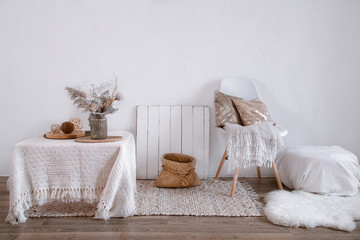 Bright interior of a cozy room with a chair and home decor.