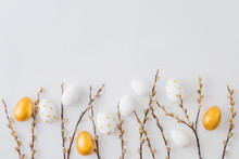 Flat Lay Easter Composition With A Willow Branch And Eggs On A White Background