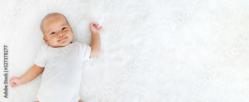 Portrait newborn baby happy over white background, topview Tableau sur Toile