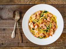 Pasta With Salmon And Spinach On Wooden Background