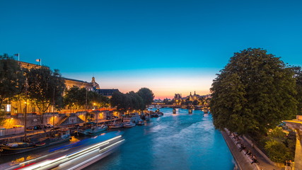 Wall Mural - View on Pont des Arts in Paris after sunset day to night timelapse, France