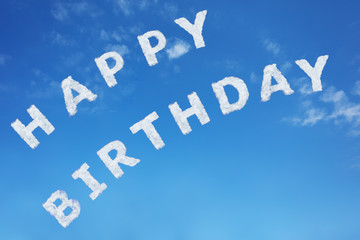 Wall Mural - Happy birthday sign text made of clouds letters over clear day blue sky