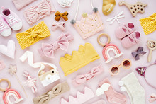 Set Of  Baby Girl Accessories On Pink Background. Various Head Band And Hair Bow, Toy, Little Shoes, Socks. Fashion Kids Stuff And Accessories. Flat Lay, Top View