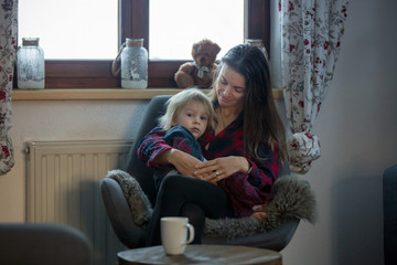 Poster - Mother and child, sitting in rocking chair