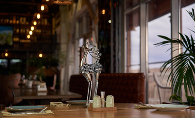 statuette on the table in a restaurant