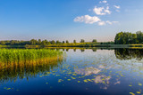 Fototapeta Zachód słońca - landscape with lake and blue sky