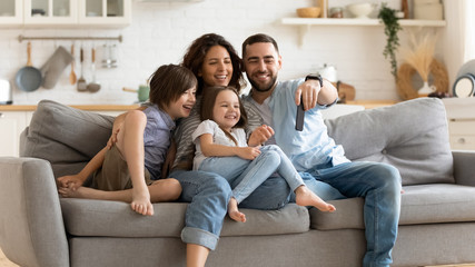 Happy family with kids have fun making selfies