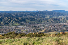 Grassy Mountaintop Cityscape View Of Streets And Homes In Suburban Simi Valley, California.