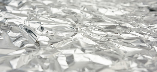 texture of frosted crumpled piece of foil, packaging material for food and objects