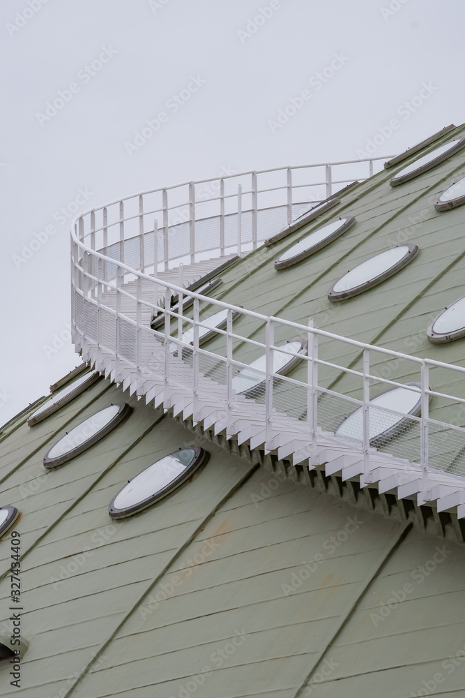Abstract Modern Building with Round Windows in a Green Dome and a Spiral Staircase around - Porto, Portugal