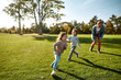 © Svitlana - Building strong bodies and minds. Excited family having fun outdoors on a sunny day